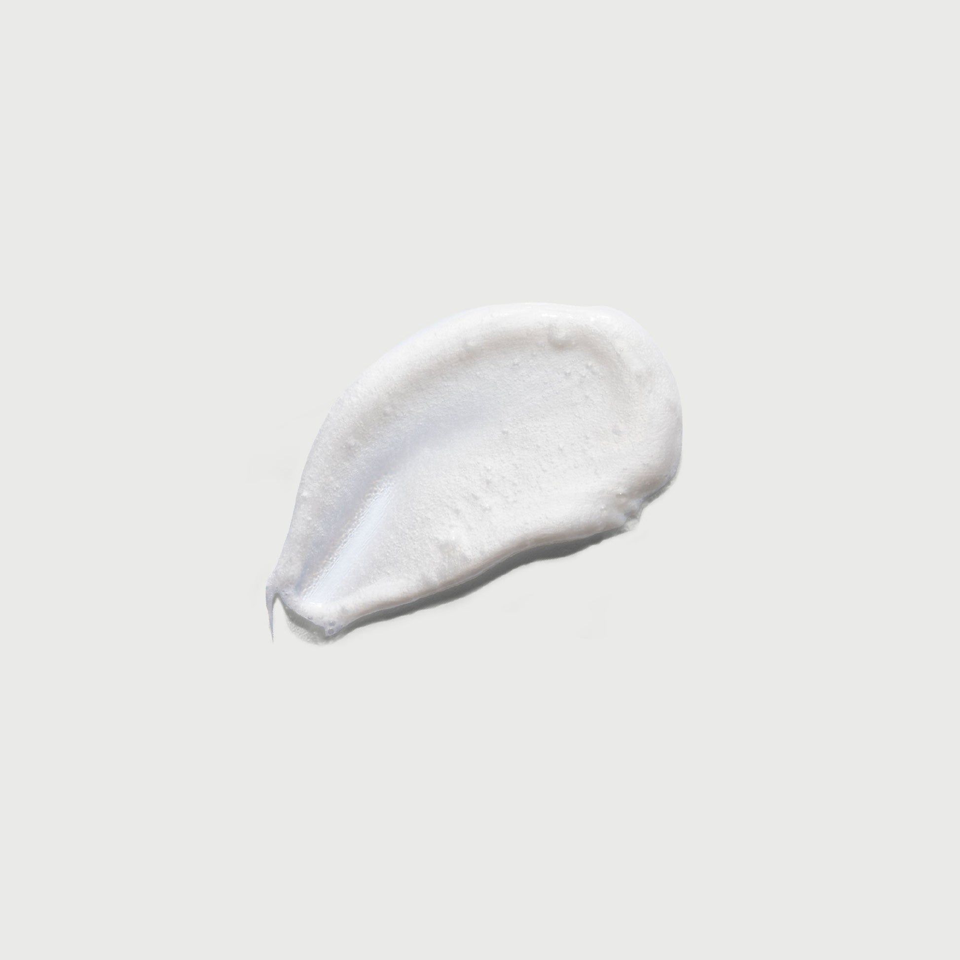the-smoother-glycolic-acid-exfoliating-body-wash-i0 NATR-40002-Swatch-The-Smoother-Glycolic-Acid-Exfoliating-Body-Wash-bonebkgd.jpg